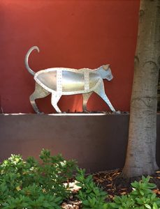 Photo of Ken Kalman's sculpture "Cat." Artwork depicts an aluminum cat.