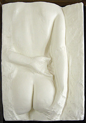 Photo of George Segal's sculpture "Gazing Woman." Artwork depicts the back of a nude woman one arm crossing her back.