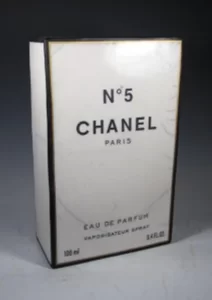 Karen Shapiro ceramic depiction of Chanel number 5 perfume box. White with black trim and text logo.