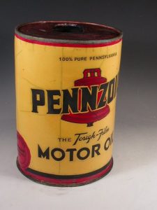 Karen Shapiro "Pennzoil" raku-fired ceramic. In the shape of a vintage oil can, a yellow background has a red bell and the Pennzoil text in black.