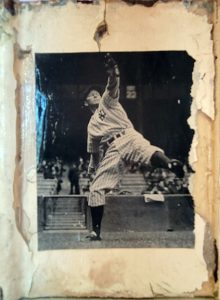 Close up of a black and white photo of a baseball pitcher from Stacey Carter's Yankee Pitch sculpture.