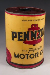 Ceramic replica of a vintage yellow Pennzoil can with a red bell logo