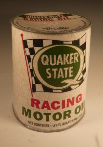 Ceramic replica of a vintage Quaker Old can with a checkered flag logo
