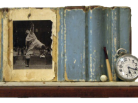 Photo of Stacey Carter's assemblage sculpture "Yankee Pitch." Artwork depicts a shelf with blue partial frame, a photo of a baseball pitcher, a small ball and bat and a watch.