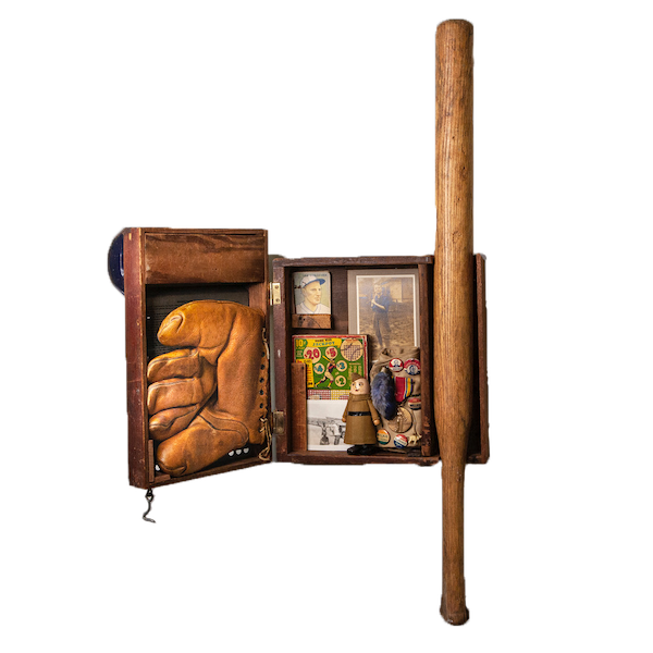 Antique tin baseball game sculpture forms the treasure chest of a boy in a baseball uniform. Old baseball cards, mitt, bat, punch game, vintage Wilson Walkie toy, vintage campaign pin, soldier's cap, WWII medal, vintage photo of soldiers playing baseball. On the side is a vintage photo of a young Black soldier.